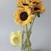 Bold, sunlit sunflowers take center stage in this cheerful flower arrangement-perfect as