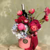 &ldquo;A luxurious floral gift box featuring vibrant peonies, tulips, hydrangeas, and premium