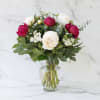 Celebrate peony season with this lush arrangement of premium red and white
