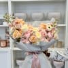 Lush hand-tied bouquet of pastel roses , spray roses ,ranunculus and stock