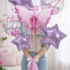 Birthday balloon bouquet with purple stars and a butterfly balloon