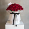 Velvet Romance features over 50 premium red roses artfully arranged in a