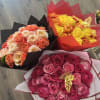 Three rose bouquets in pink, yellow, and peach tones wrapped in colored paper