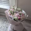 A delicate symphony of soft pinks, creamy whites, and fresh greens, Blush