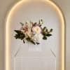 Classic compact rounded mix of cymbidium, hydrangea, rose and lisianthus in a