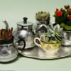 A whimsical tabletop arrangement that feels like a cozy tea party for