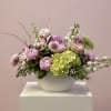 A luxurious arrangement of lush pink peonies, thoughtfully designed to feel romantic