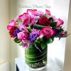 This compact, lush bouquet pairs roses, carnations, daisies, and alstroemeria for a