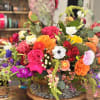 Bright, sculptural and full of personality - this mixed-color flower arrangement makes