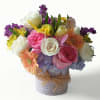 Roses hydrangeas daisies stock and more arranged in a modern glass vase