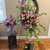 A complete funeral tribute collection featuring a handcrafted standing wreath, coordinating floral