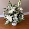 An elegant all-white floral arrangement featuring premium roses, fragrant lilies, snapdragons, stock