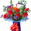 Lush clusters of red and orange roses make an immediate, joyful statement-perfect
