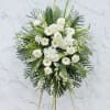 An impressive sympathy design of white roses, hydrangea, orchids, lilies, gerbera daisies