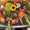Sunflowers and a central green hydrangea make a bold, sunny statement in