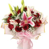 Deep red roses meet pink-and-lilies in a romantic flower arrangement that reads