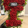 A large heart-shaped arrangement of tightly packed red roses makes an unforgettable