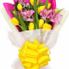 Sunny yellow tulips paired with soft pink alstroemeria create a cheerful spring-ready