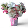Lovely roses orchids and so much more arranged in a tall modern