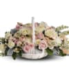 To offer comfort and consolation, these serene, softly colored roses and chrysanthemums