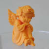 Small orange/gold 3D-printed angel figurine (approx. 4" H x 3" W) 
Only
