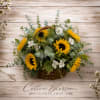A basket full of Sunflowers with a touch of Peruvian Lilies and