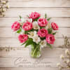 A beautiful arrangement for that special someone. Delicate pink tulips paired with