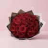 Two dozen red roses beautifully wrapped and ready to gift. Make it