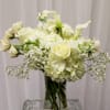 White floral arrangement in a clear glass vase