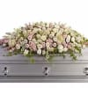A beautiful spray of soft pink, white and cr&egrave;me blooms ease the