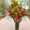 featuring a Cymbidium orchid, with roses, and seasonal flowers