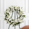 A classic white and green sympathy wreath. 