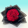 Bouquet of red roses wrapped in black paper