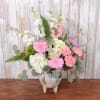 The perfect arrangement for welcoming a new baby girl into the world!