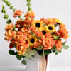A burst of warm color and sunny texture-this flower arrangement is a