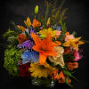 A vibrant, mixed-color Designer's Choice flower arrangement that makes a joyful anniversary