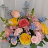 Beautiful garden roses, delphinium, snap dragons, spray roses in a distressed hidden