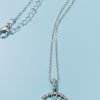 A delicate Tree of Life sterling silver necklace framed with rhinestone crystals