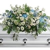 As soft and delicate as a tender remembrance, this stunning spray of