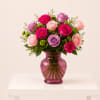 Elegant floral arrangement designed with a beautiful mix of premium roses in