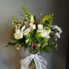 All white with a touch a pink vase arrangement 