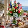 This Tall and Showy Patrioctic themed arrangment is sure to be a