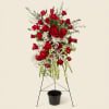 A Lasting Rose makes a solemn, comforting statement as a sympathy standing