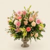 A cloud of soft pinks, peaches, creams, and pale greens creates an
