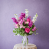 A fresh mix of peonies, roses and stock in pink, white and