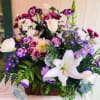Basket filled with fragrant purple and white blooms. Perfect for birthday, anniversary