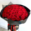 A round bouquet of 100 red roses, wrapped in black paper. 

Flower