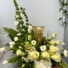 White and pale yellow floral arrangement with a gold vase centerpiece