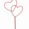Two red heart-shaped picks on a single stem