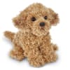 Small tan plush dog with curly fur and black eyes